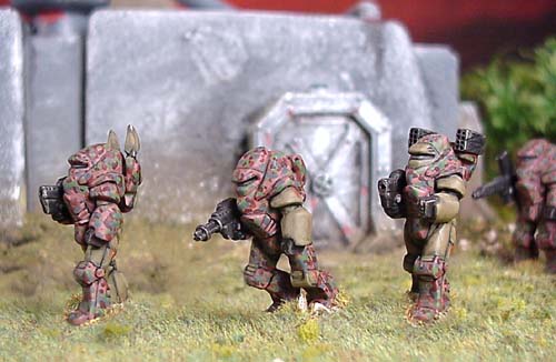 Power Armour in use with the Zaporoskiye Brigade. These troops use mostly coil guns supplemented by mini buzz bombs